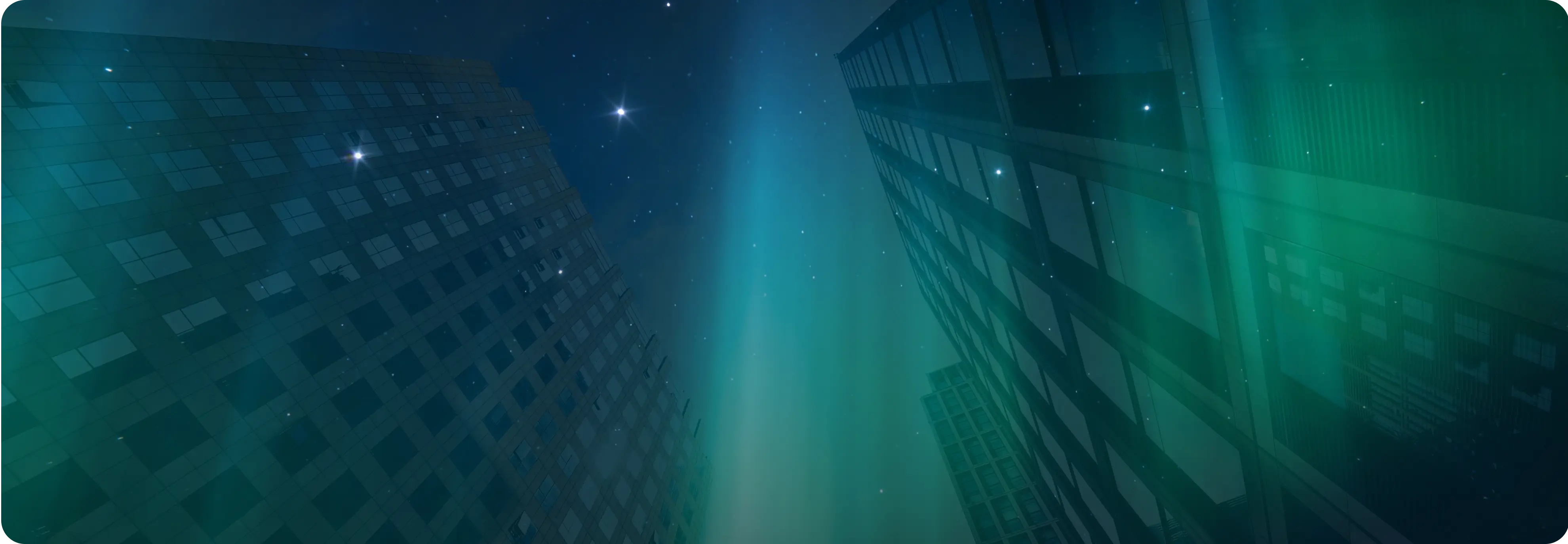 Modern glass office towers lit by aurora light